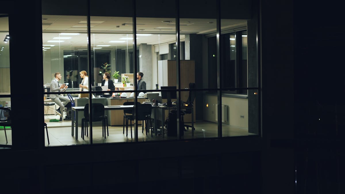 Executive-focused security image with dark office mood and high-risk atmosphere.